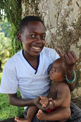 Children in Equatorial Guinea proudly show the dot of ink on their finger that demonstrates they have received a dose of oral polio vaccine. 